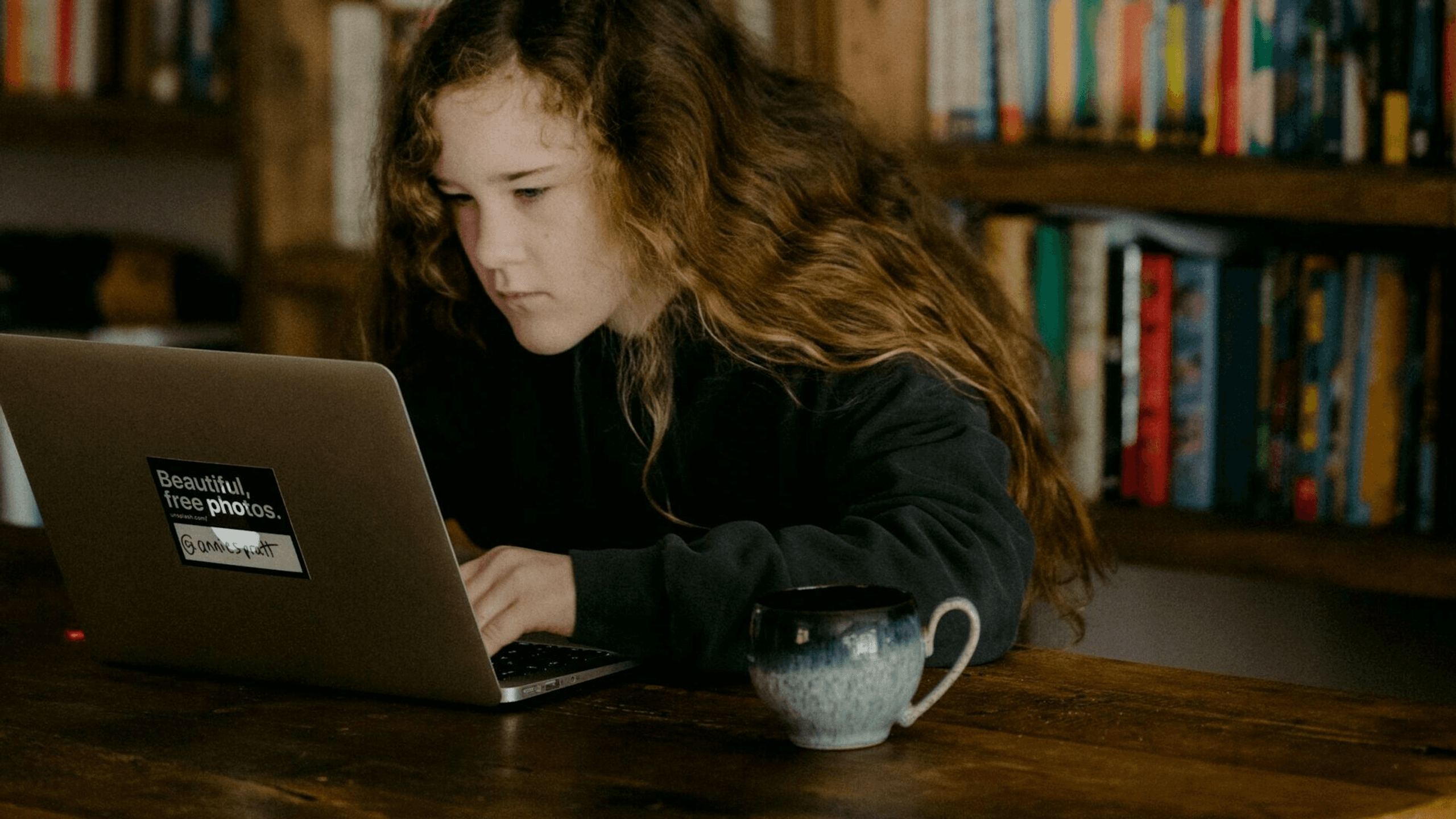 Young girl working with a computer